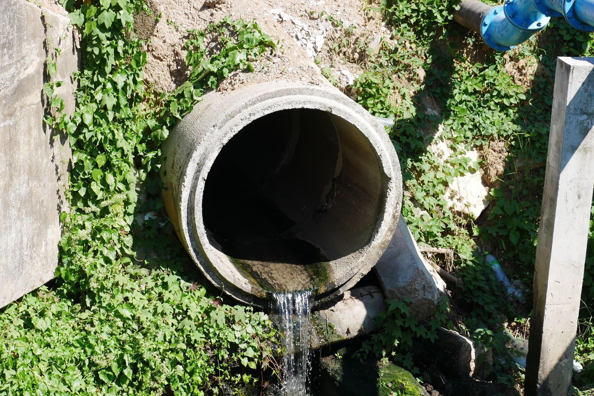 A concrete pipe with water coming out of it