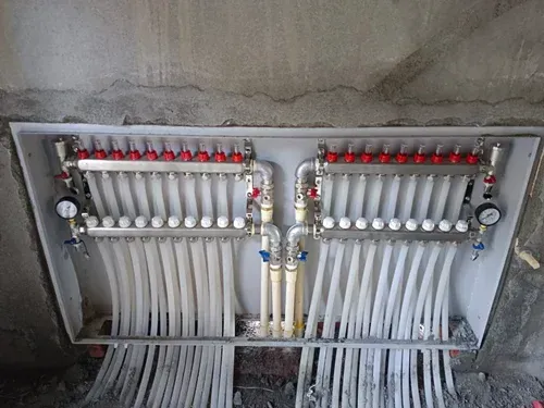 A box filled with lots of pipes and valves.