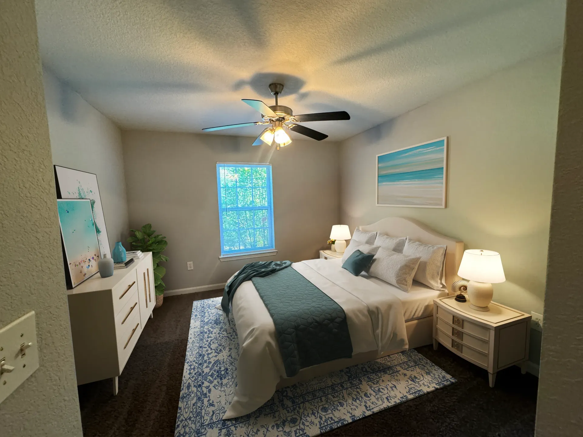 Bedroom with a king-size bed, dresser, nightstands, and ceiling fan.
