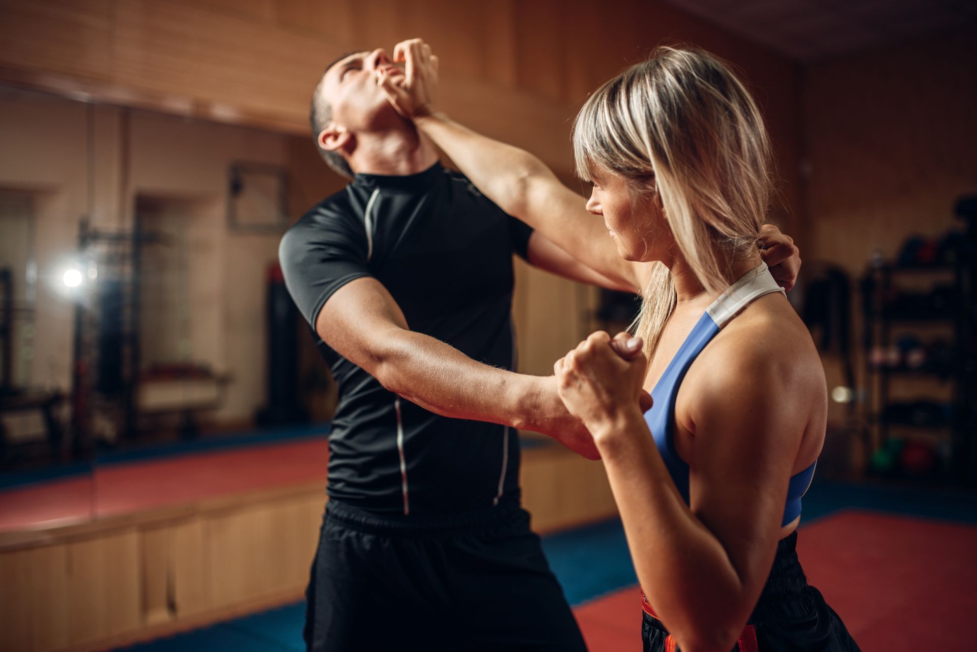 Man and woman training in self defense