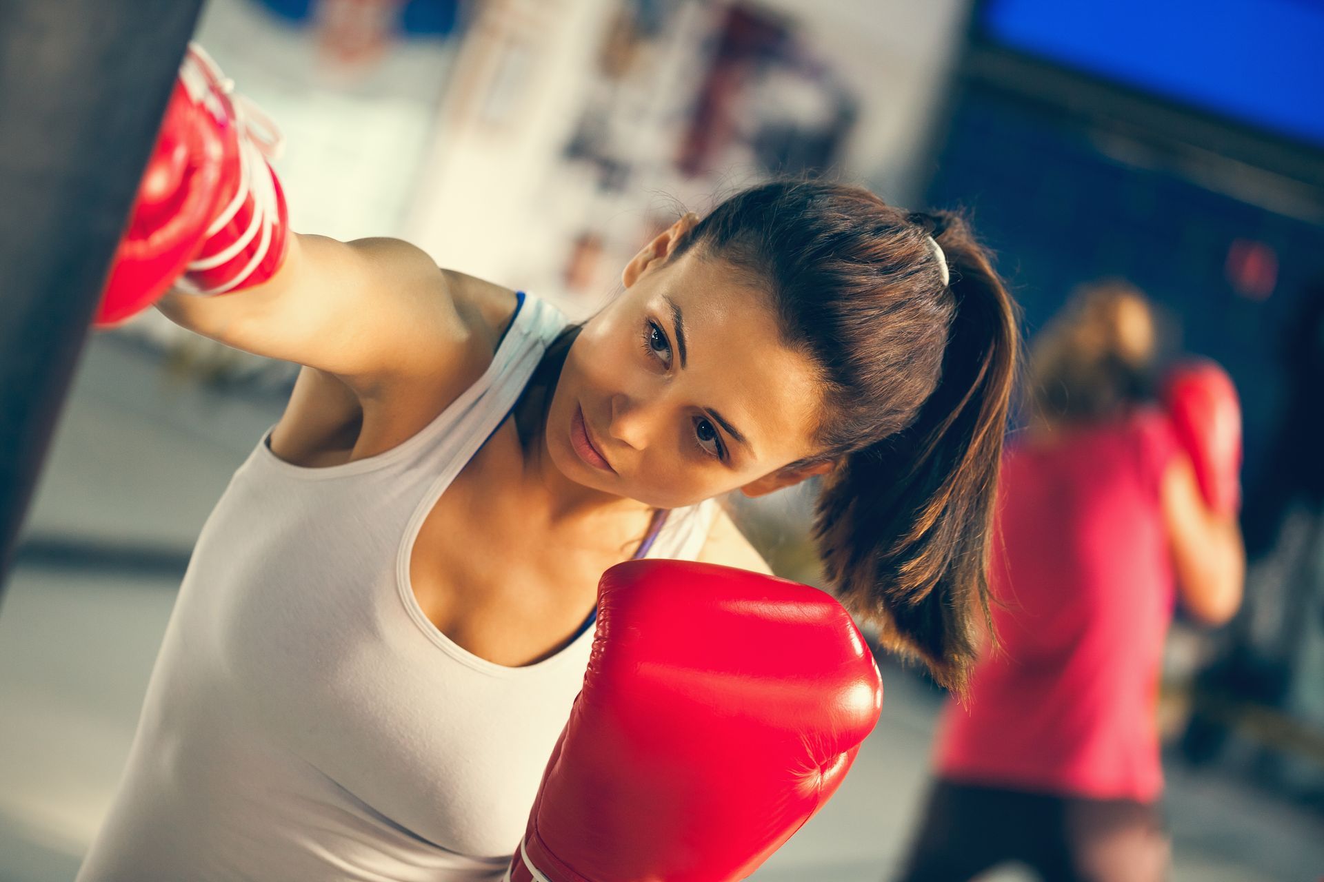 Young adults punching with their right arm