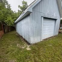 Long wooden deck beside a house