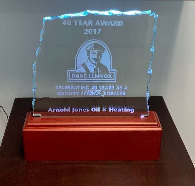 Crystal award plaque on red base, commemorating 40-year anniversary for Arnold Jones Oil & Heating.