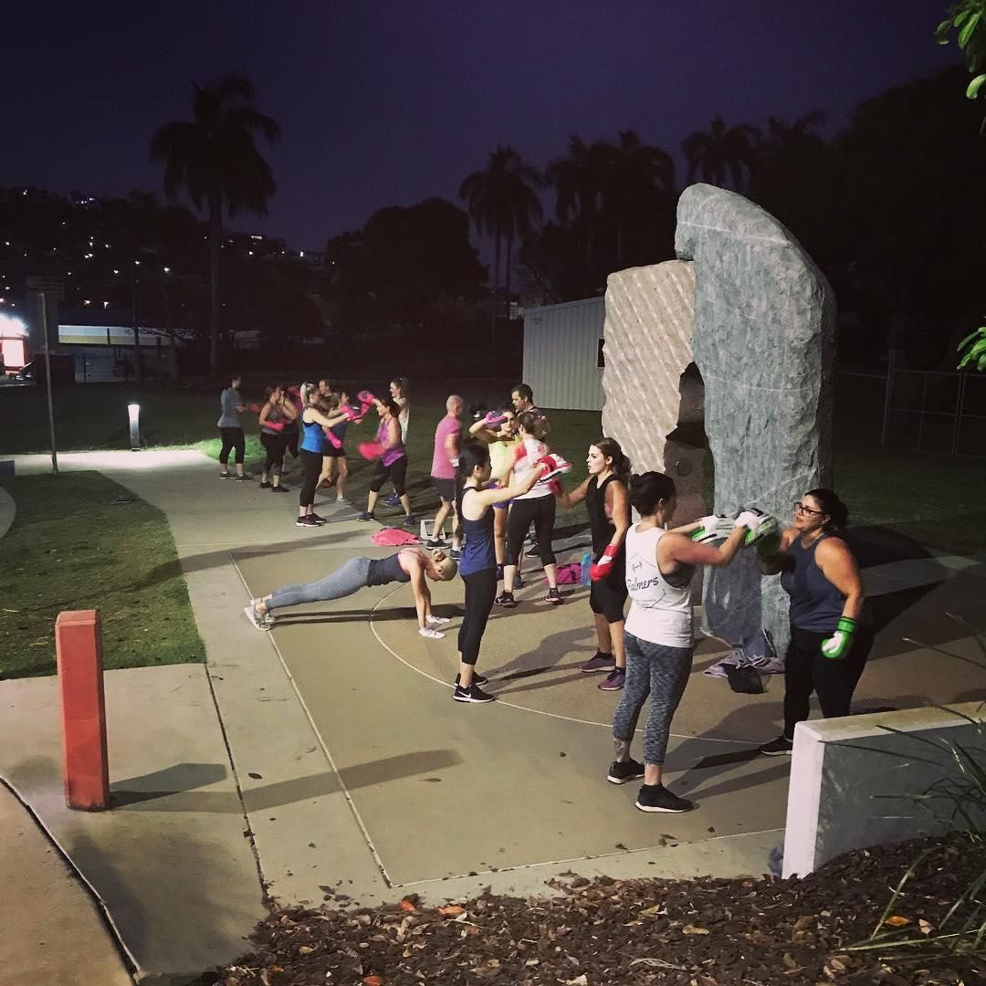 A Group of People Practicing Boxing in The Night β Health First Townsville In Townsville, QLD