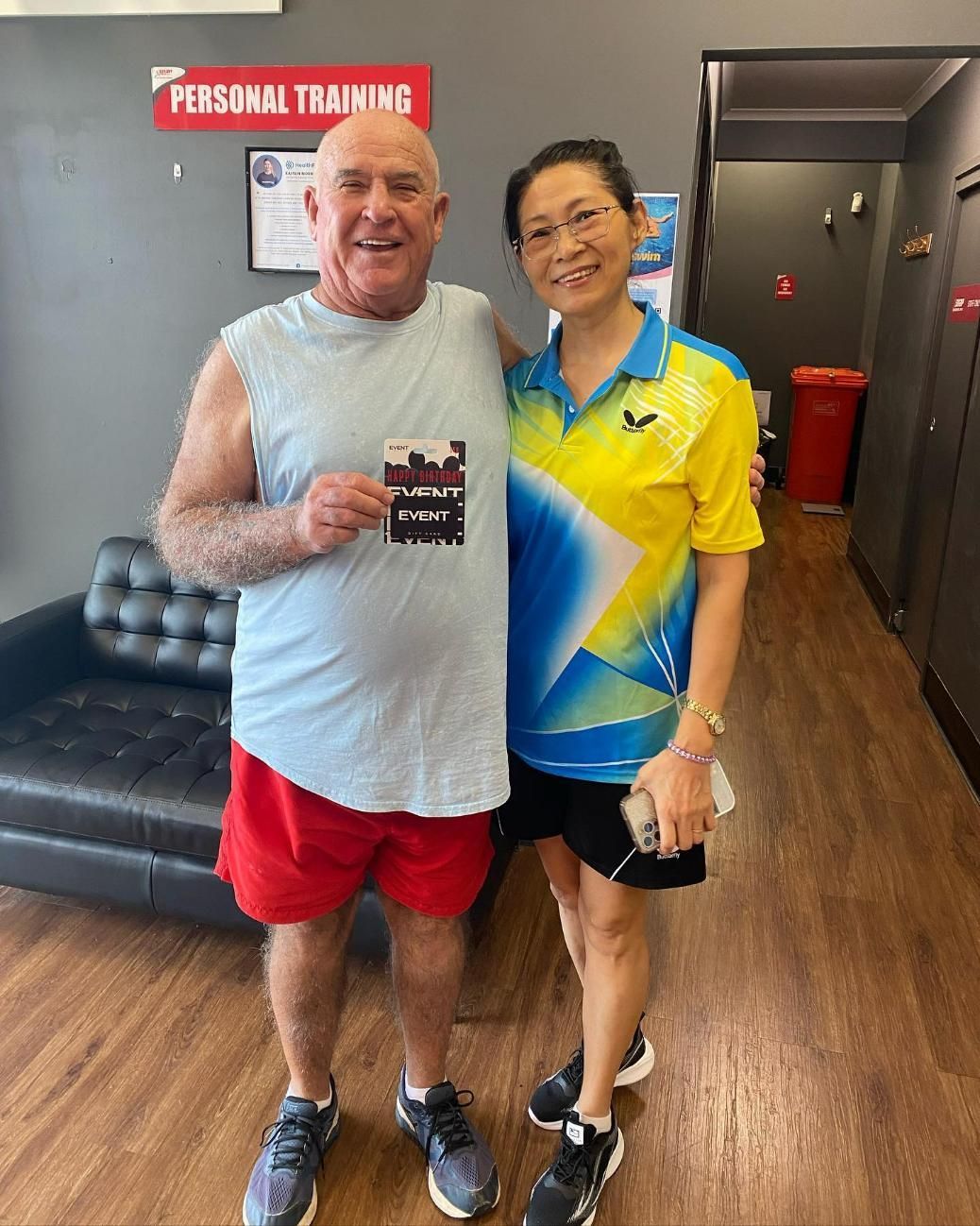 A Man and a Woman Are Posing for a Picture in a Gym — Health First Townsville In Townsville, QLD