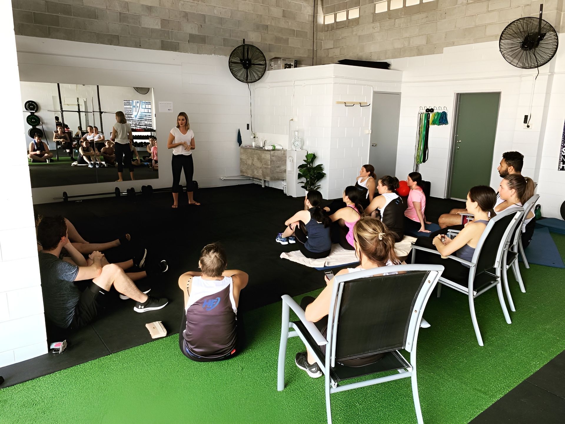 A Group of People Are Sitting in Chairs in a Gym β Health First Townsville In Townsville, QLD