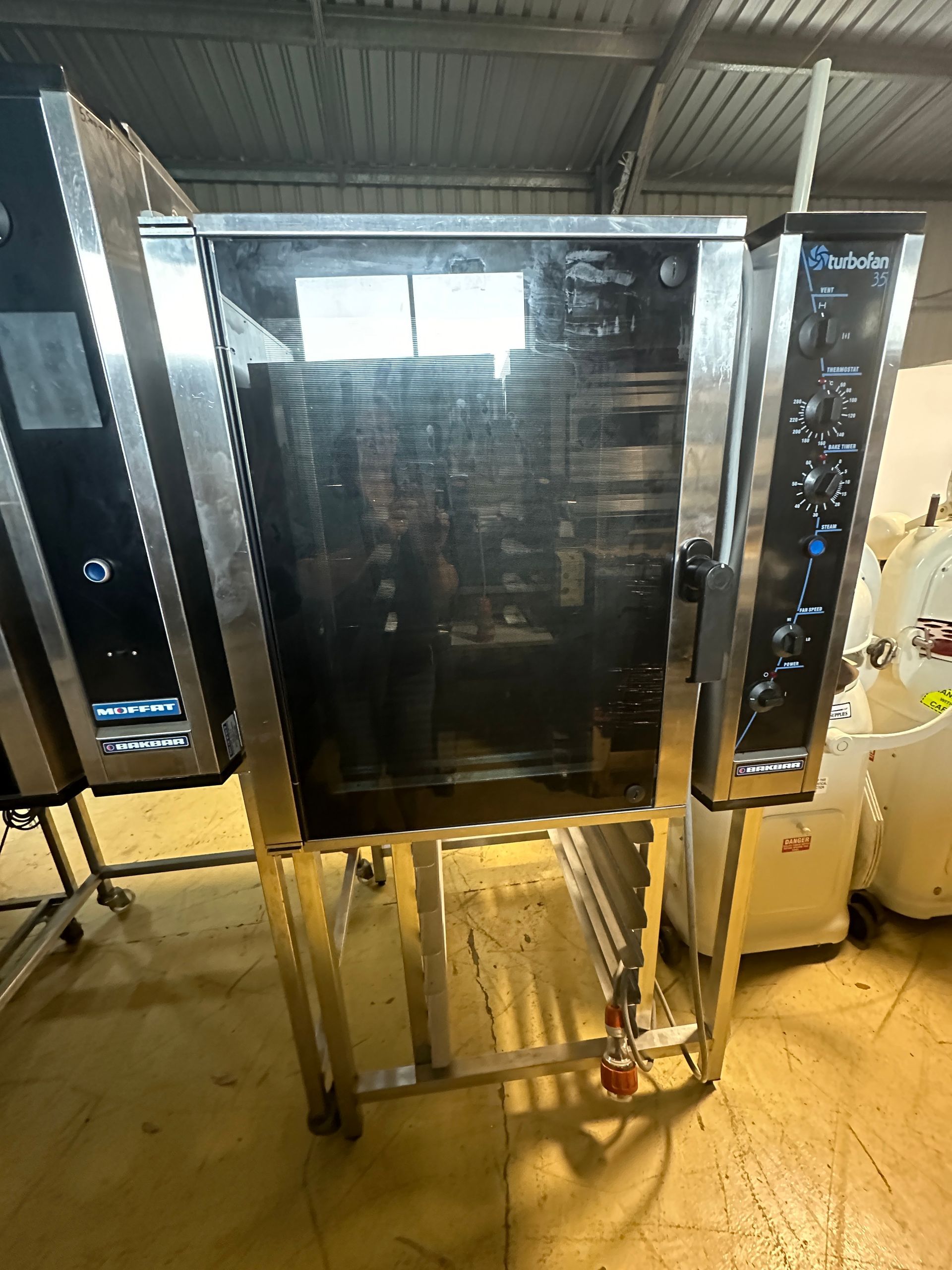 A stainless steel oven with the word hotel on it