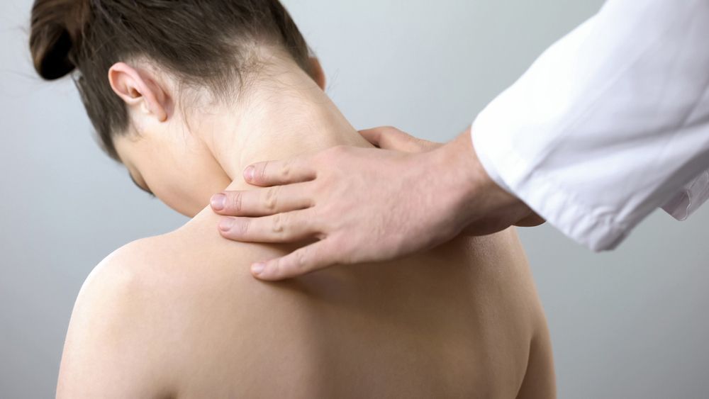 A Woman is Getting a Massage From a Doctor — AMC Exercise Physiology in Maitland, NSW