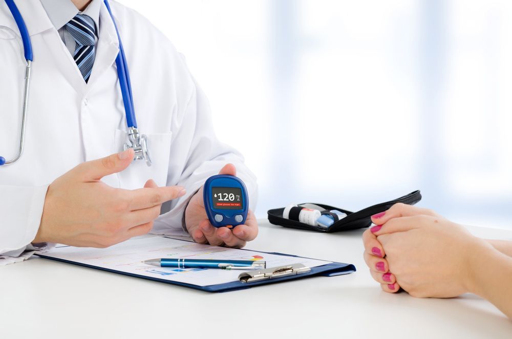 Doctor Showing the Cholesterol Count to a Patient — AMC Exercise Physiology in Maitland, NSW