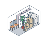 Small storage room with stacked boxes, a potted plant, chairs, and a refrigerator along the walls.