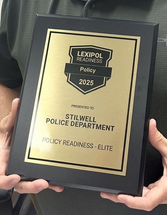 Chief Chad Smith with Lexipol award.