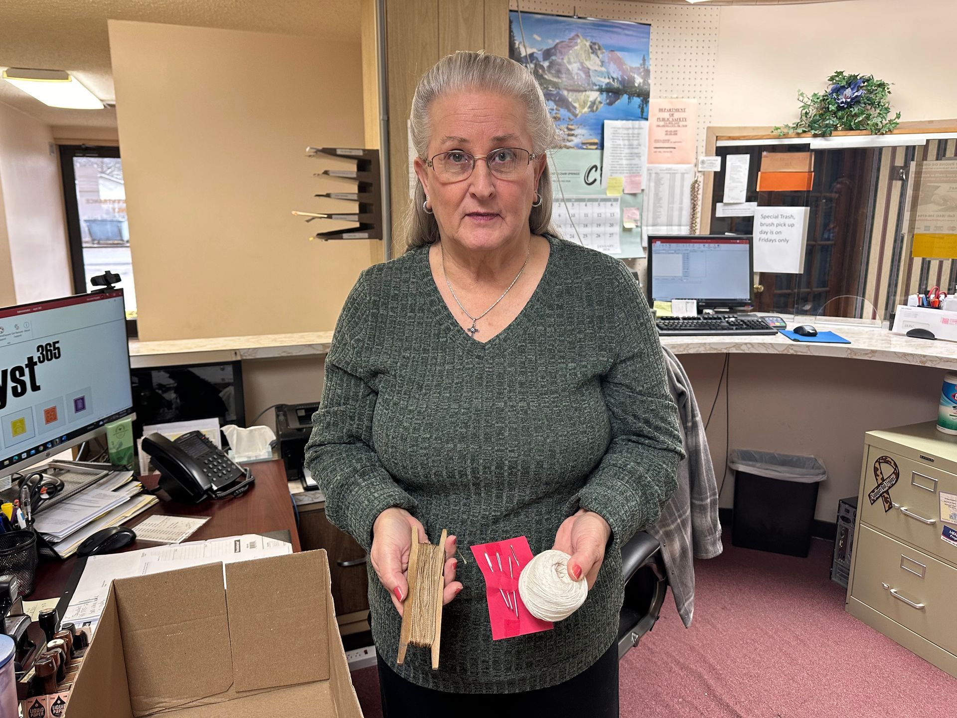 City of Stilwell staff Denise Brown displays cord and large needles that were used in past elections. City of Stilwell staff Denise Brown displays cord and large needles that were used in past elections.