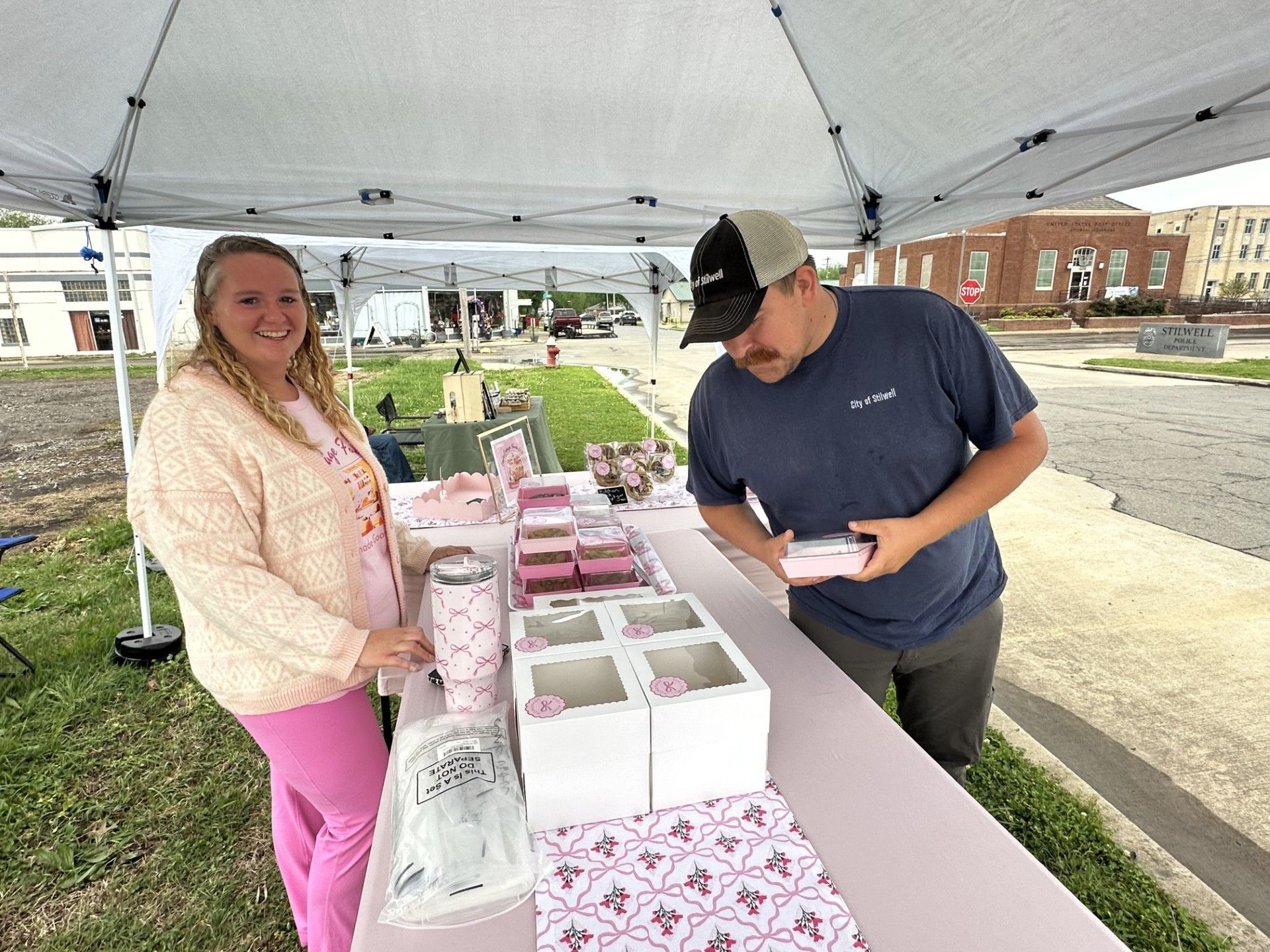 Vendor Veronica Lewis, with Lewis Cottage Foods, sells sweets to Tyler Rinehart.