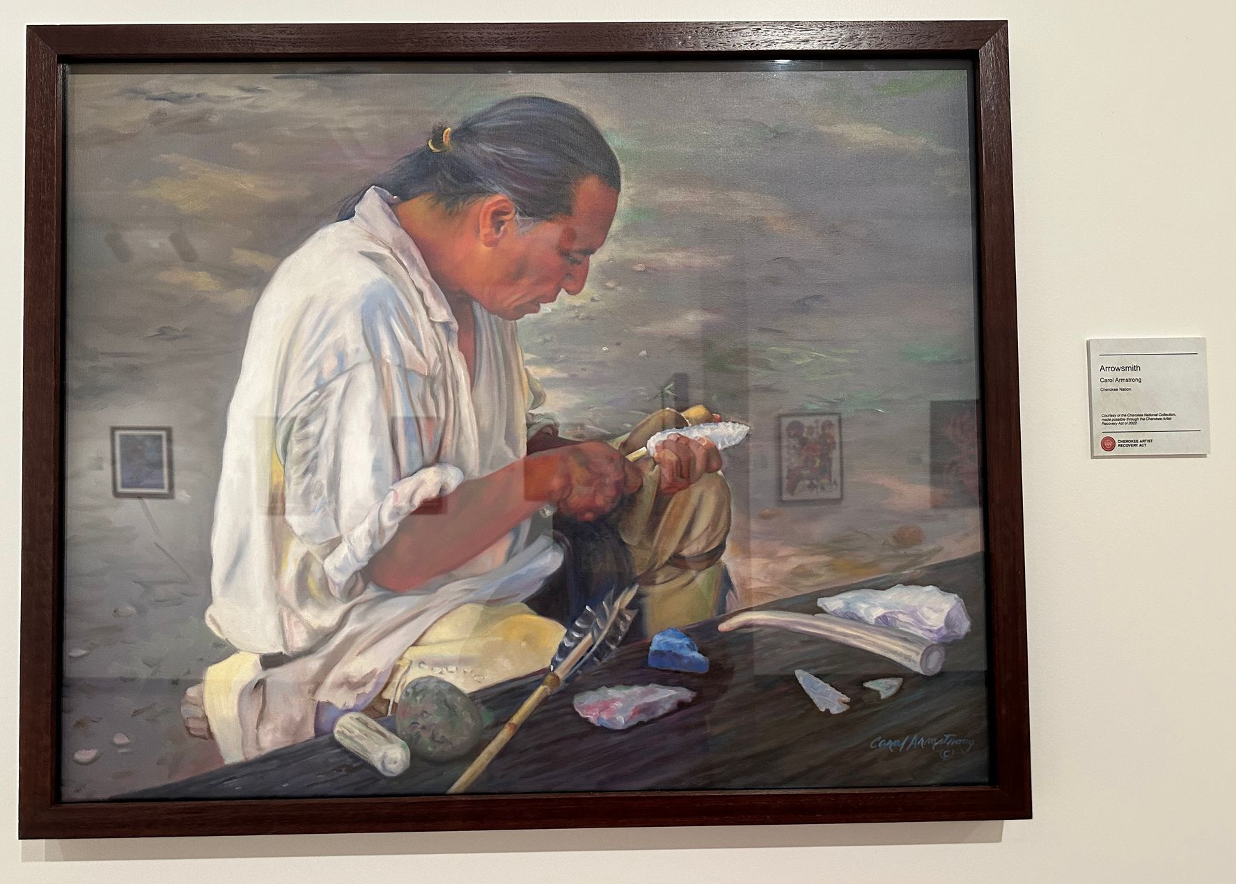 Painting of a Cherokee artist at work in the Ani Art Center
