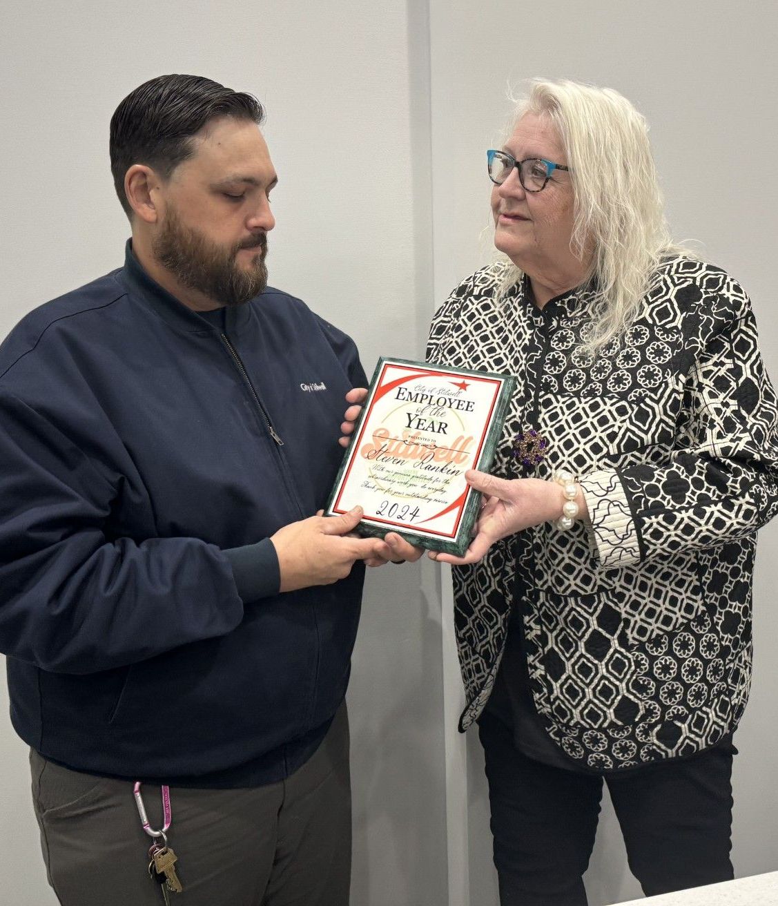Steven Rankin receives the City of Stilwell Employee of the Year plaque from Mayor Jean Ann Wright
