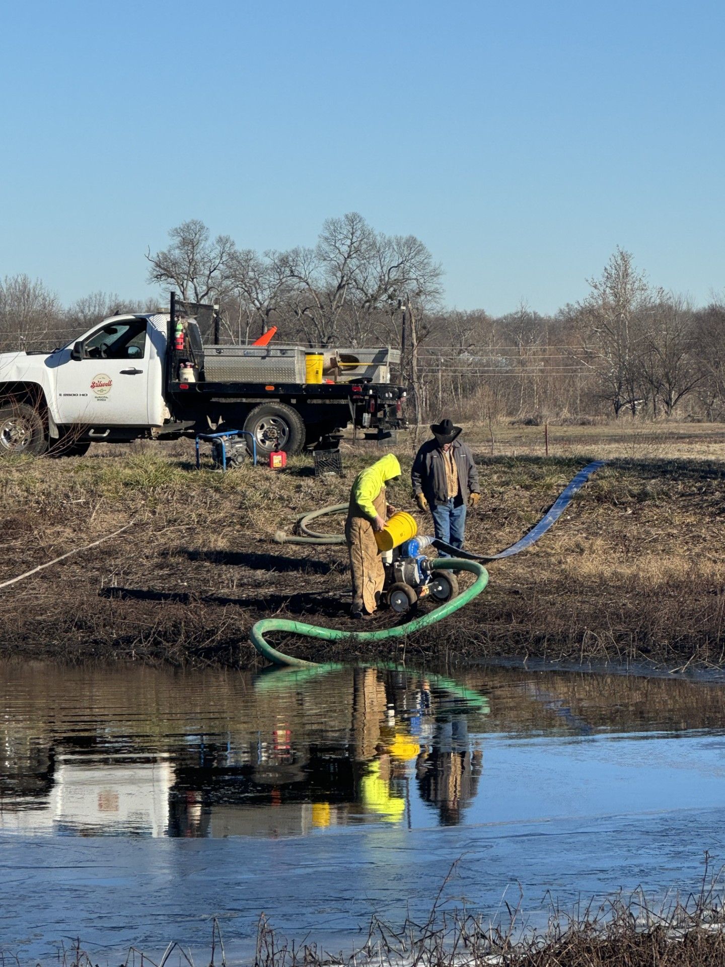City crew pumping water out of the pond at Carson Park