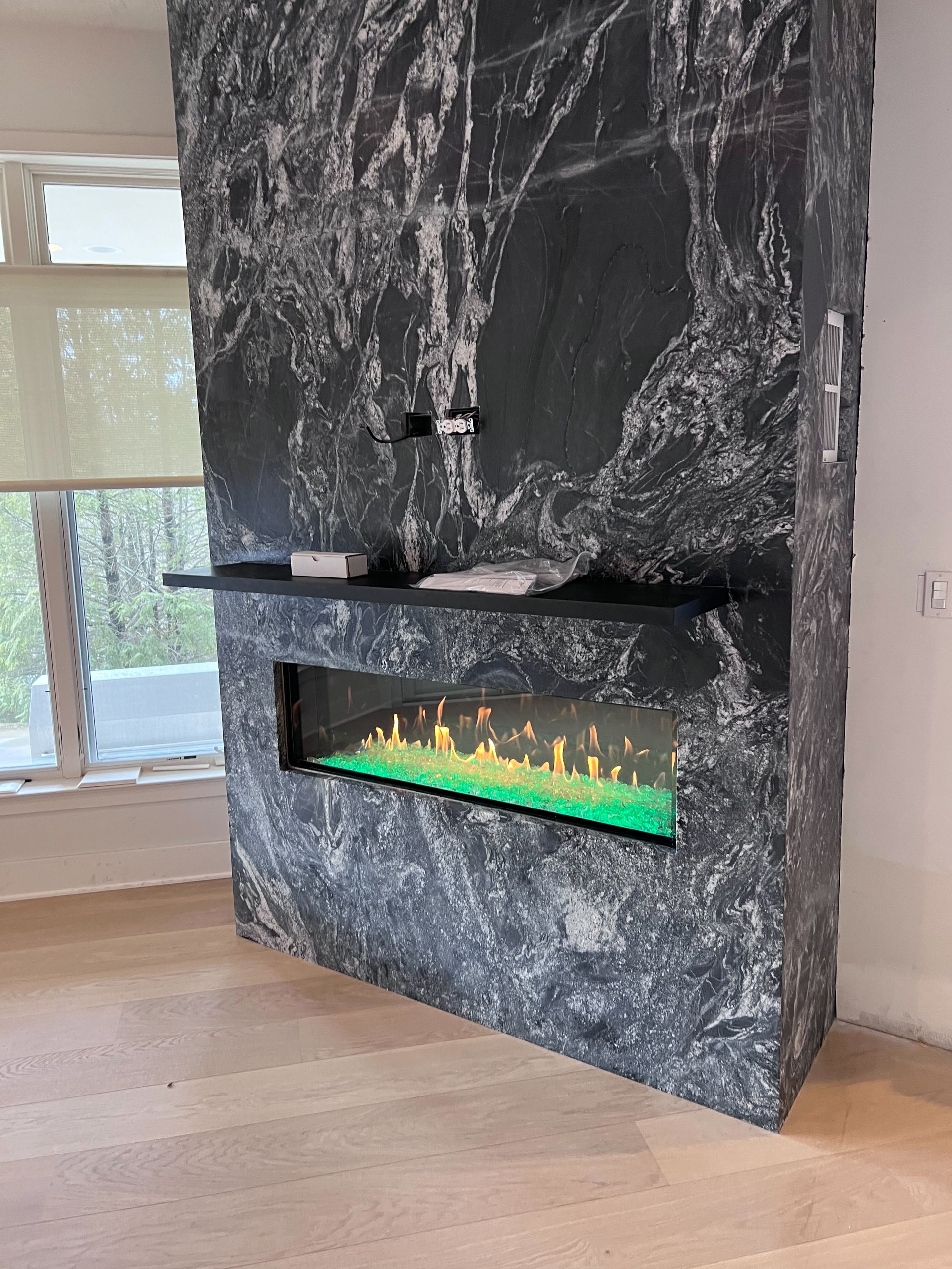 There is a fireplace in the middle of the room.