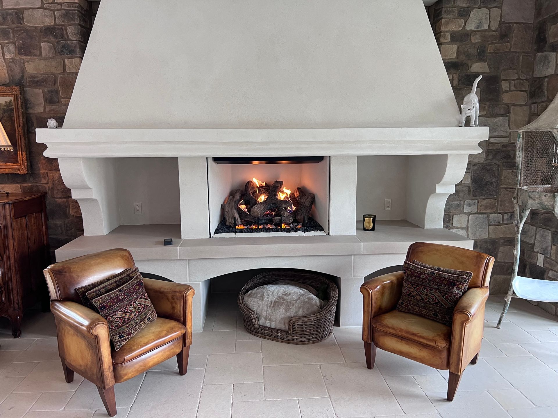 A living room with two chairs and a fireplace