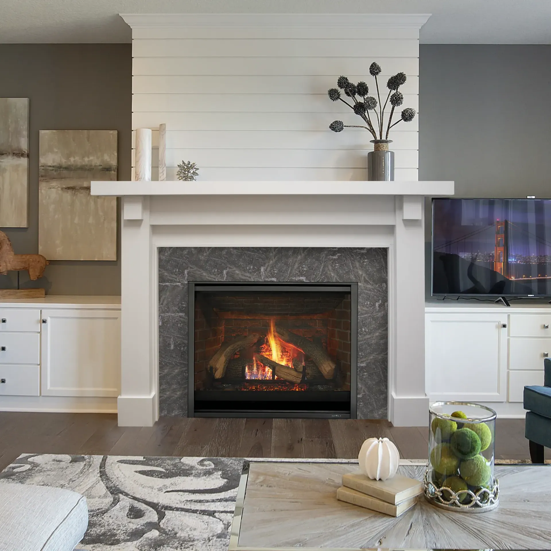 A living room with a fireplace and a flat screen tv
