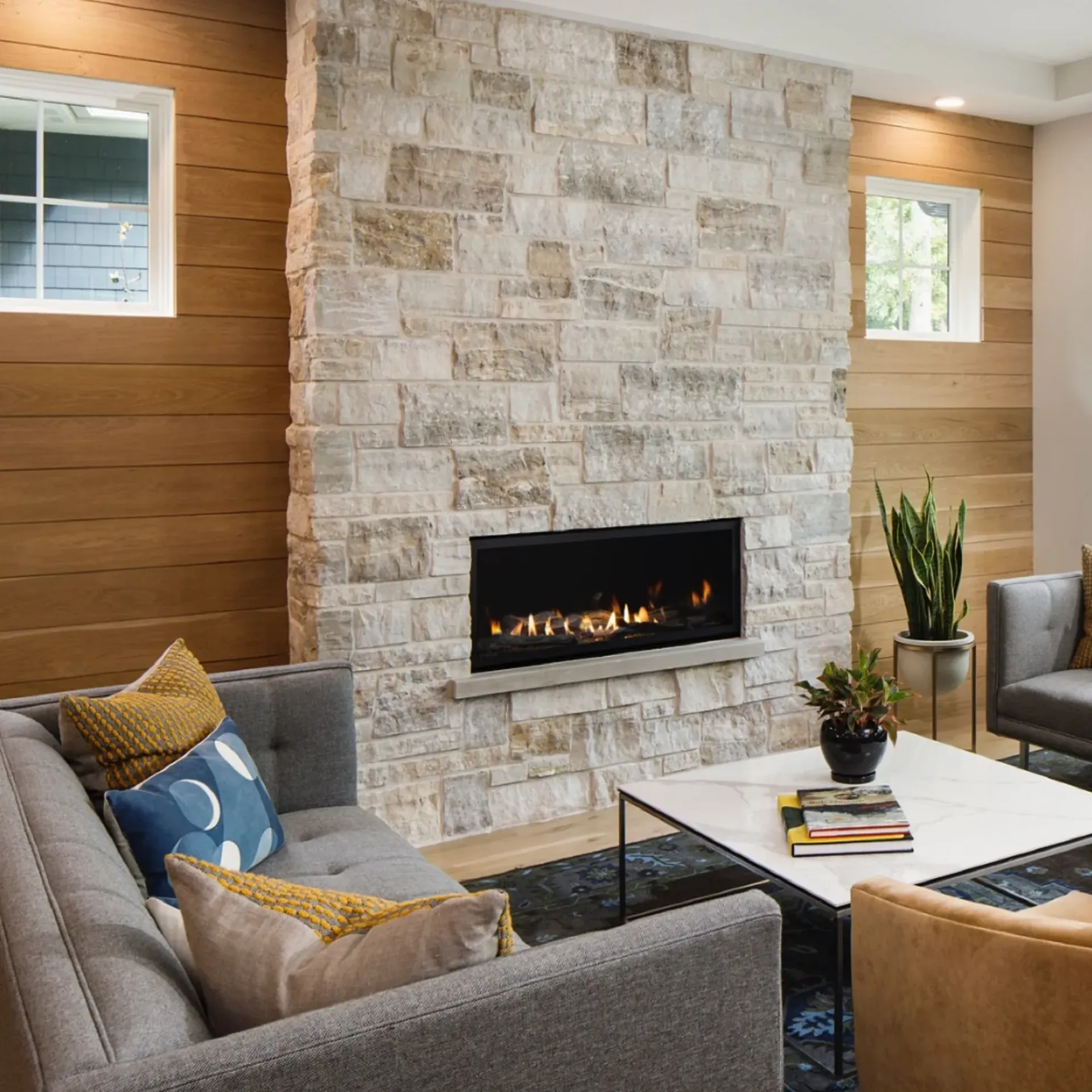 A living room with a fireplace and a couch