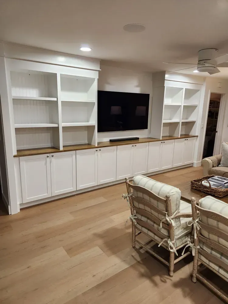 A living room filled with furniture and a flat screen tv.