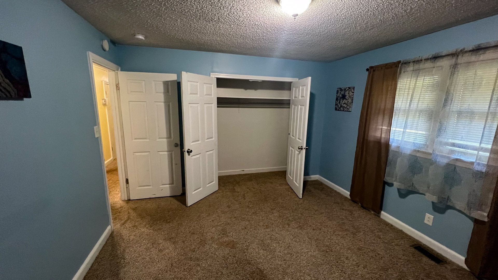 There is a large closet in the middle of the room.