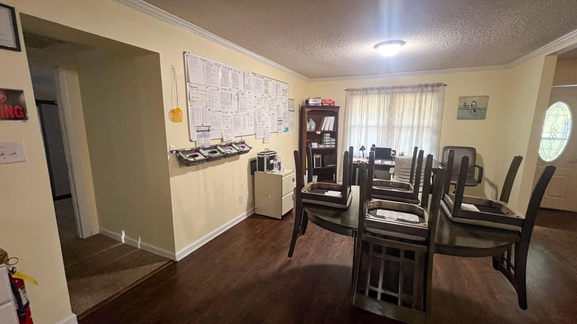 A dining room with a table and chairs in a house.