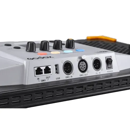 Close-up of a gray audio mixer panel with knobs, input ports, and a black vented base