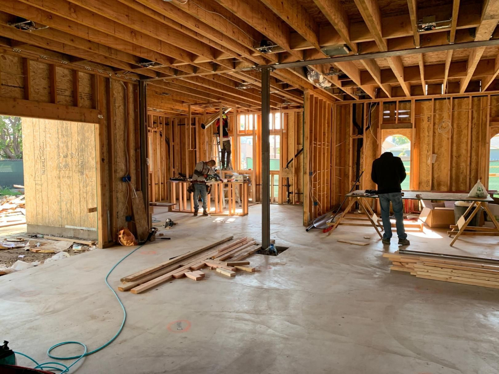 Interior of a house under construction with exposed wood framing