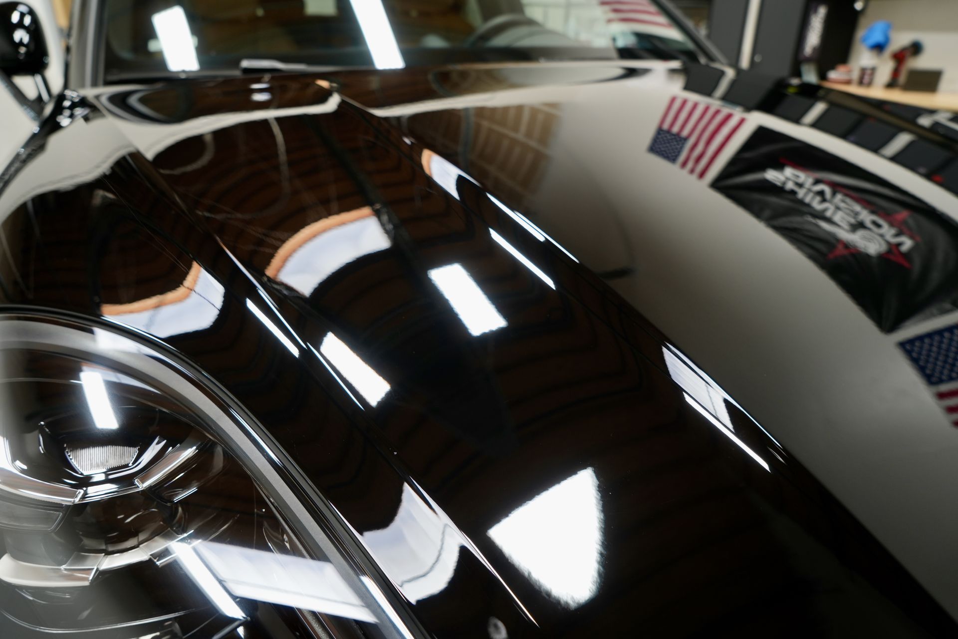 A close up of the hood of a black car