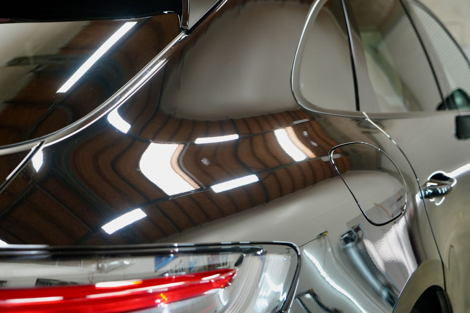 A close up of a car 's headlight and hood