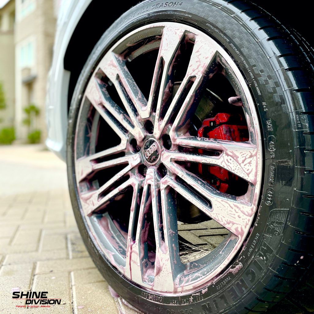 A close up of a car wheel with foam on it.