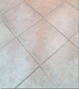 Light beige tiled floor with diagonal grout lines.