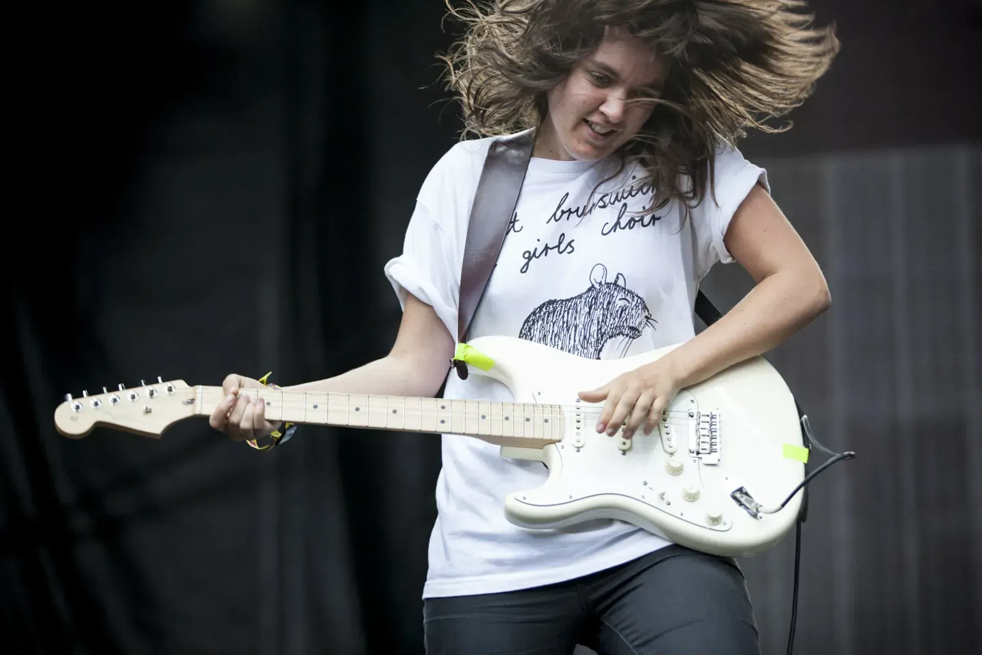 Courtney Barnett playing electric guitar live on stage