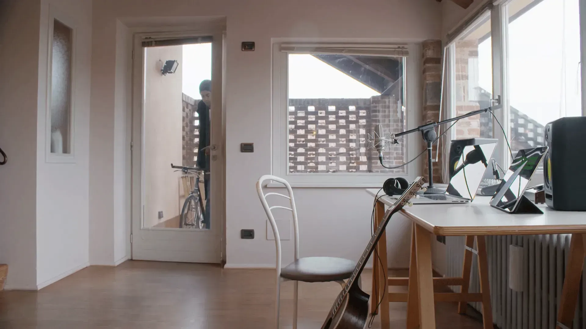 Home recording studio setup with microphone and audio equipment
