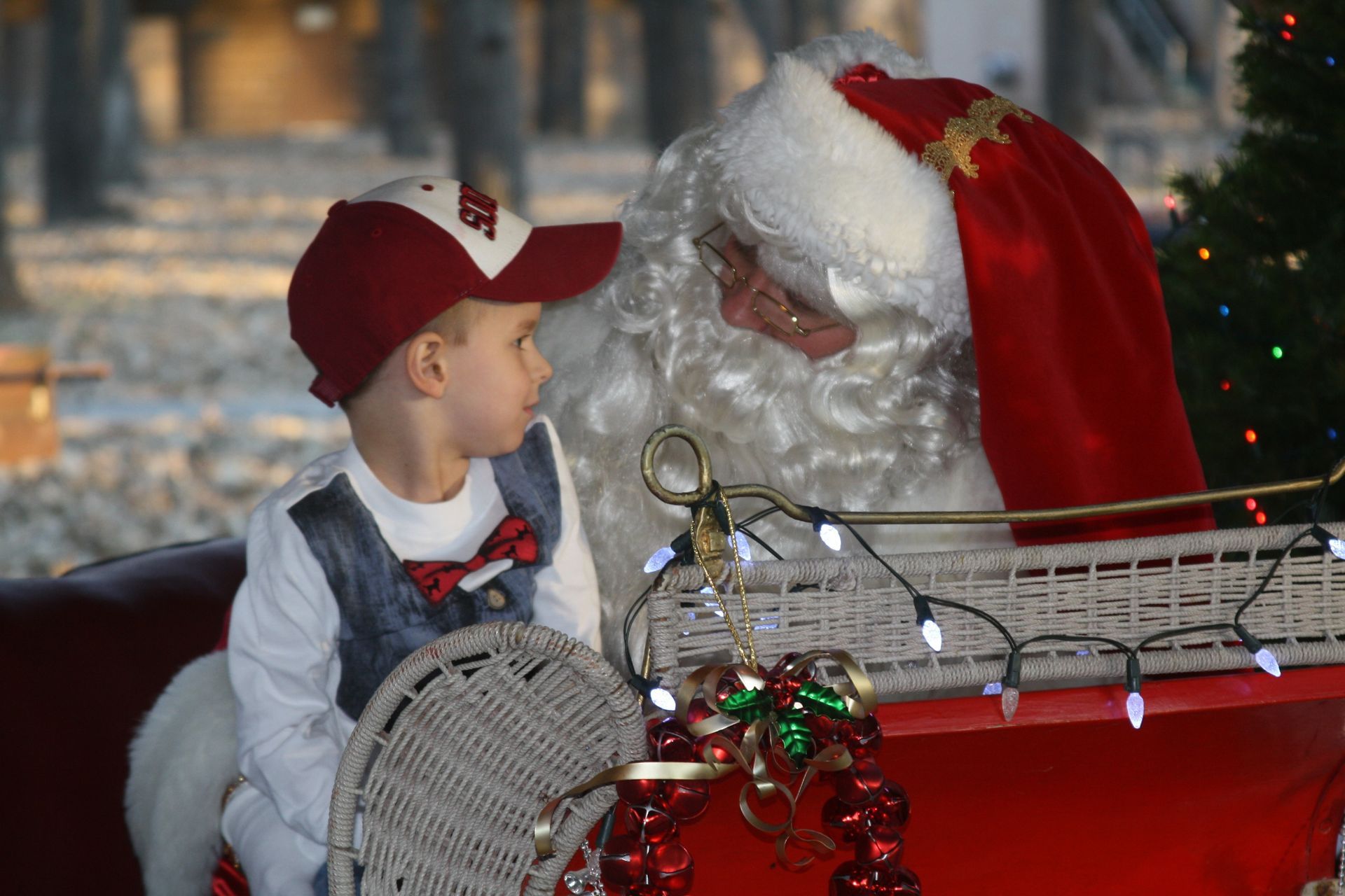 child on santa's lap in carriage