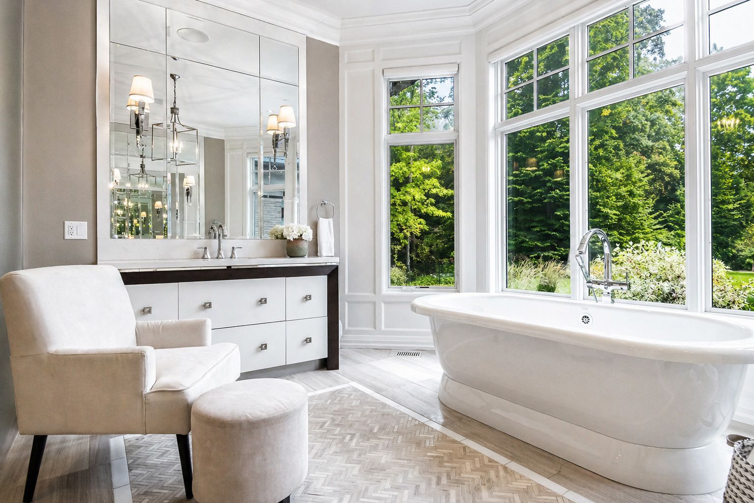 Bright hallway with white double doors opening to a sunlit room and garden view, hardwood floors, and a side table with plants