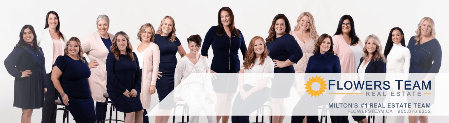 A group of women are posing for a picture together.