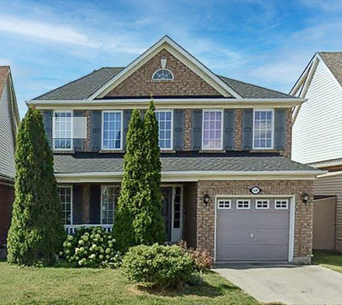 Townhouses and single car garage detached homes in the Clarke neighbourhood of Milton, Ontario
