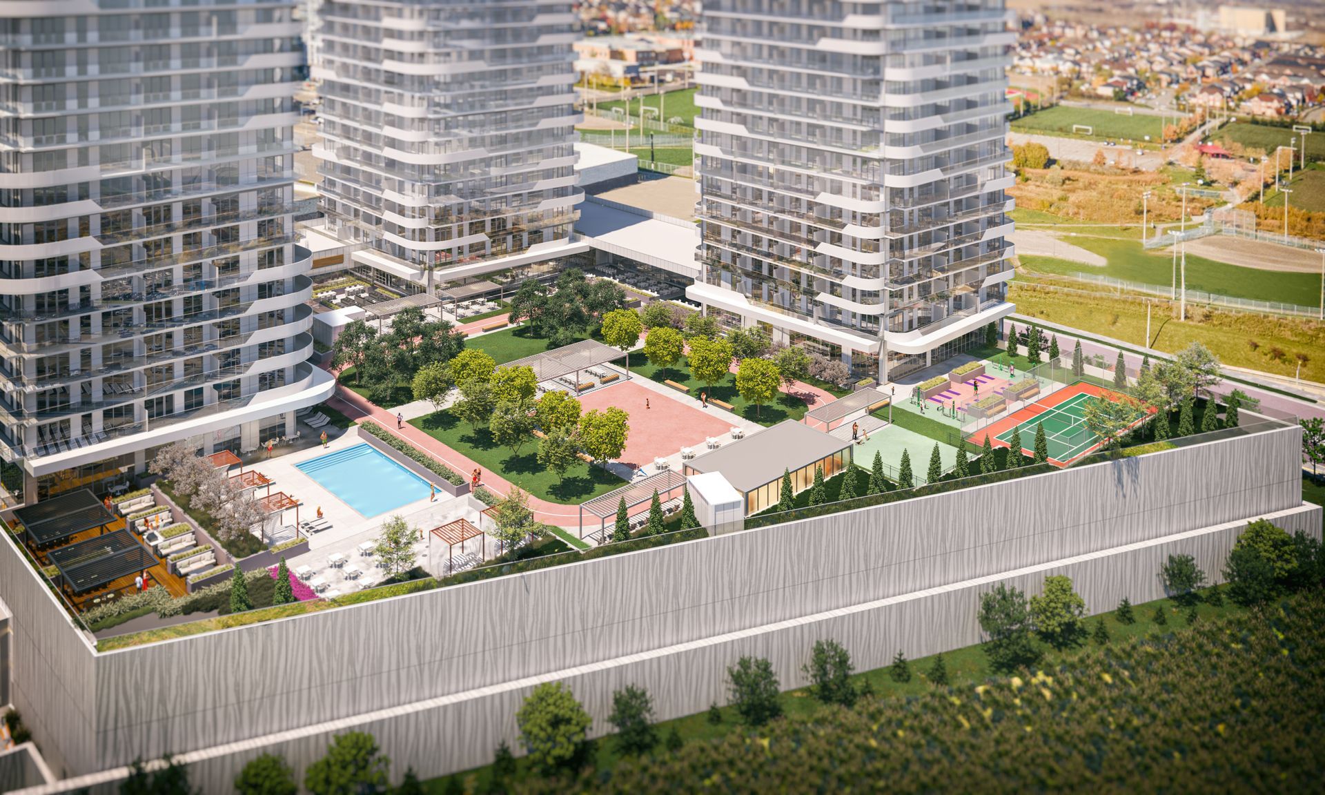 An aerial view of a large apartment building with a pool and a playground.