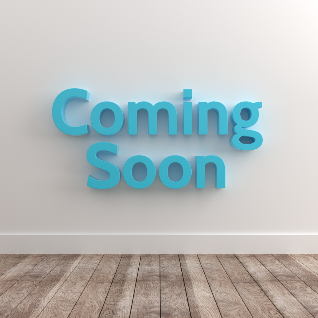 Blue “Coming Soon” text on a white wall above a wooden floor