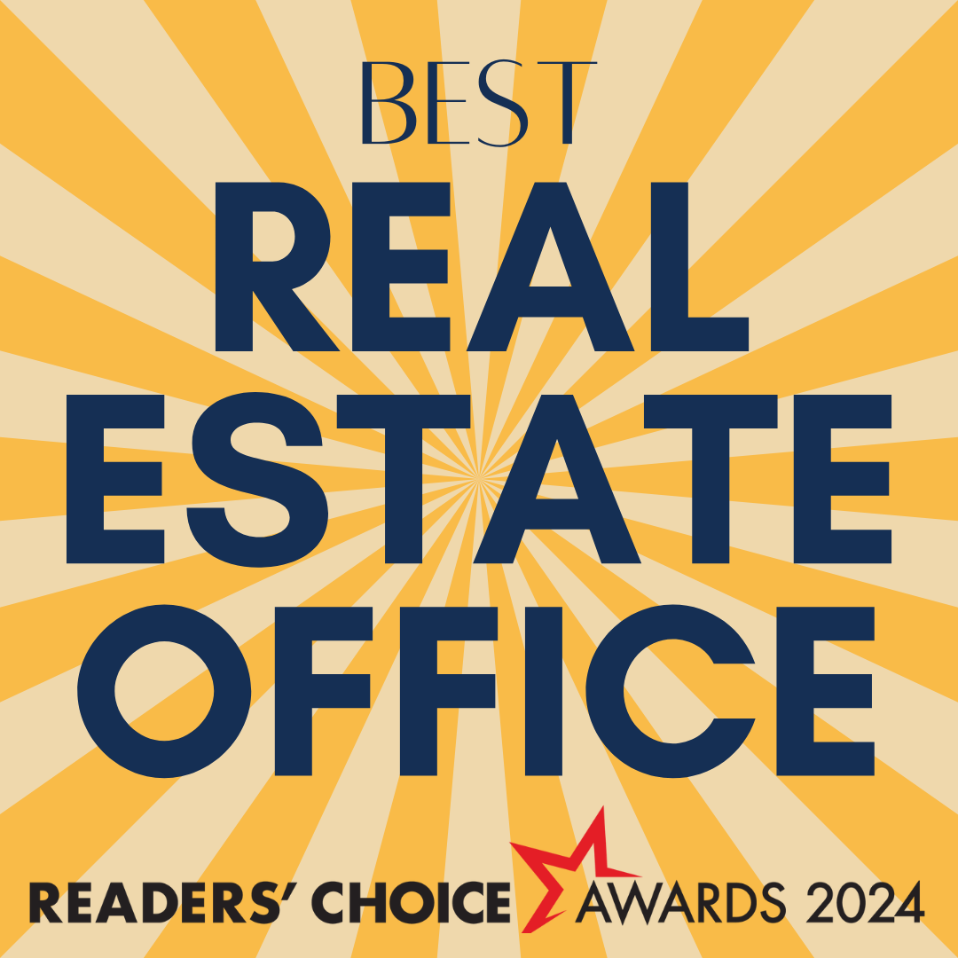 A sign that says best real estate office on it