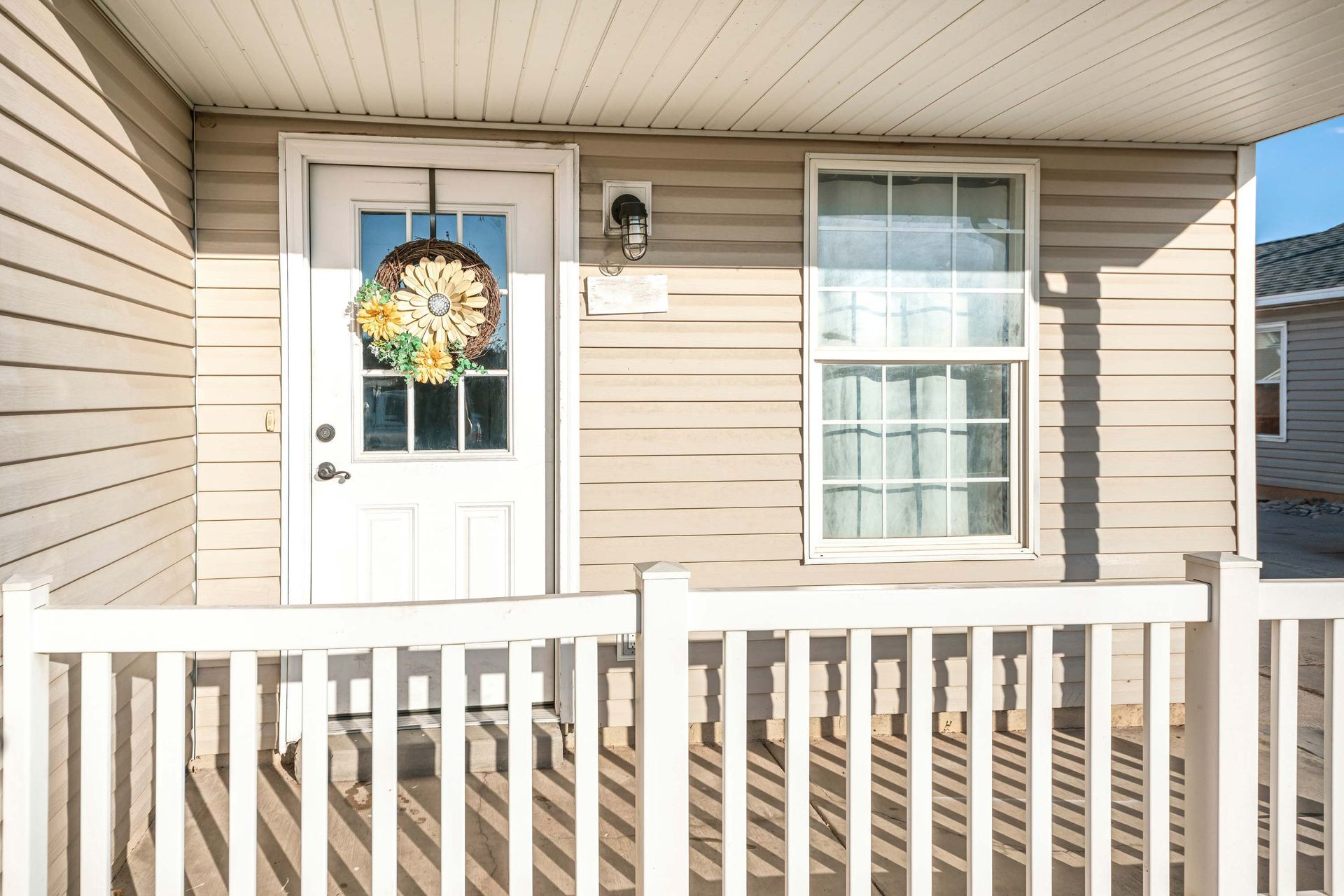 Front Porch With Beige Siding