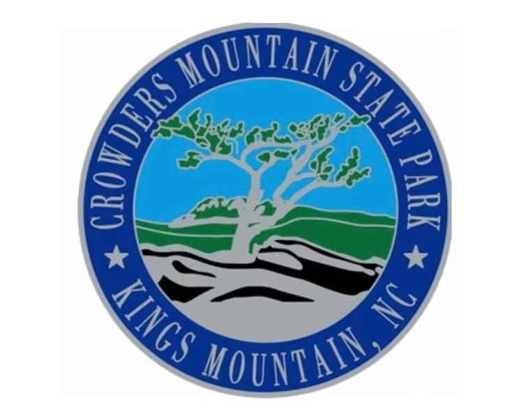 Crowders Mountain State Park, Kings Mountain, NC circular logo with blue border and mountain scene