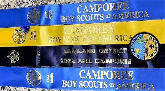 A group of boy scouts of america ribbons are sitting on a table.