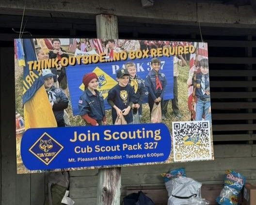 Scouting recruitment banner for Cub Scout Pack 327, with children in uniforms and a QR code.