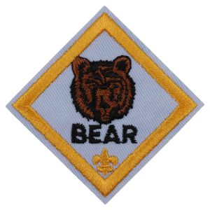 A bear badge with a cub scout fleur de lis on it