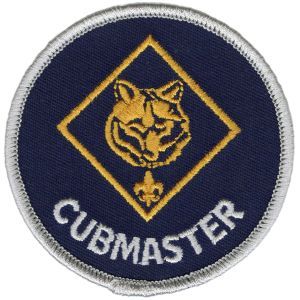 A blue patch that says cubmaster on it