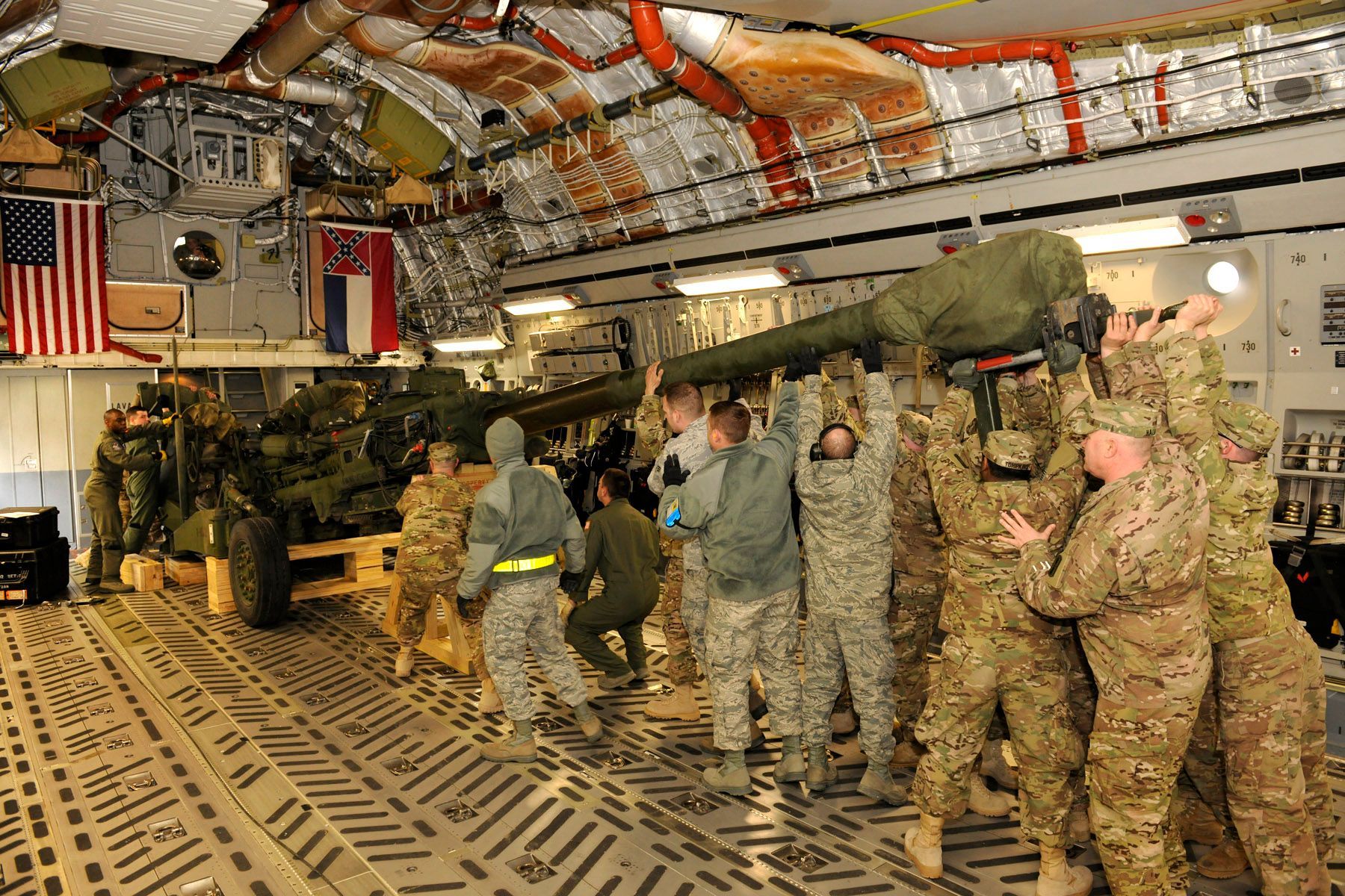 Group of soldiers surrounding a tank
