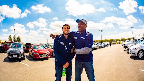 Tim Moran Auto Group Members Outside on a Sunny Day